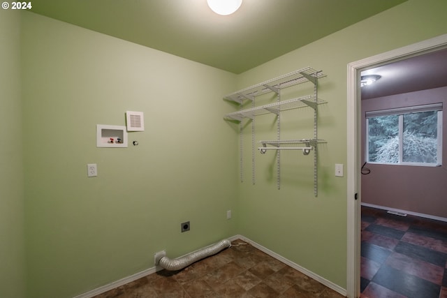 clothes washing area featuring washer hookup and hookup for an electric dryer