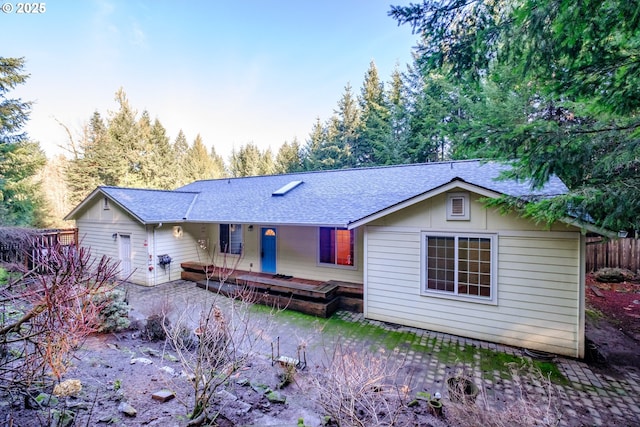 view of front of house with a wooden deck