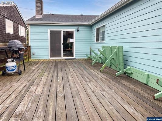 wooden terrace with area for grilling