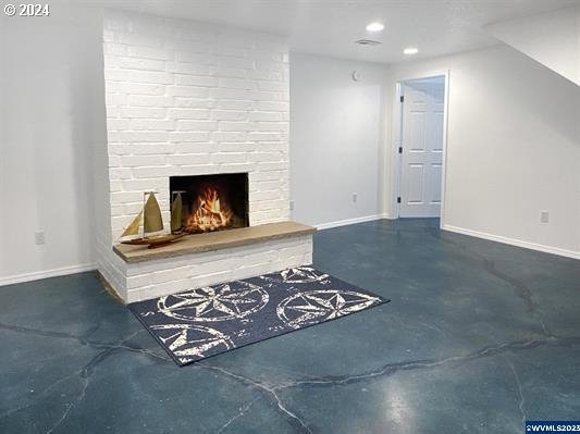 unfurnished living room with a fireplace