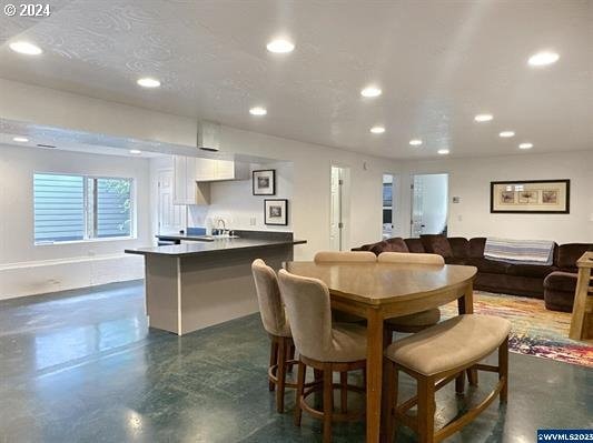 dining room with a textured ceiling