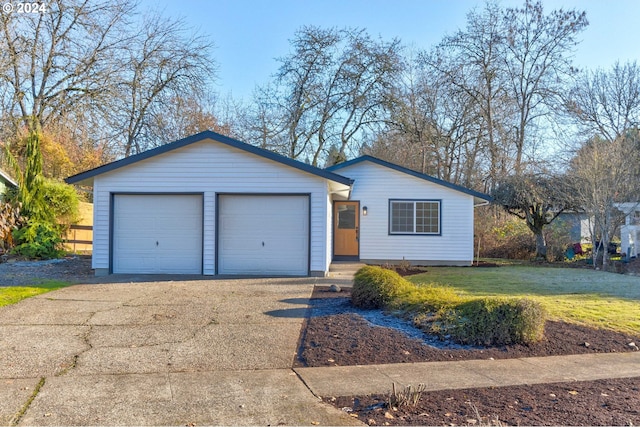 ranch-style home featuring a front yard and a garage