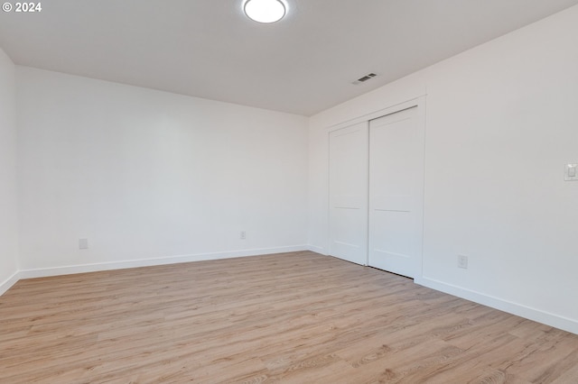 spare room with light hardwood / wood-style flooring