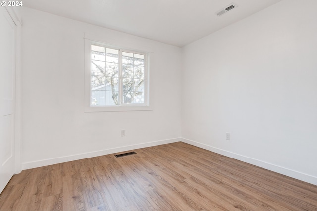 spare room featuring light hardwood / wood-style flooring