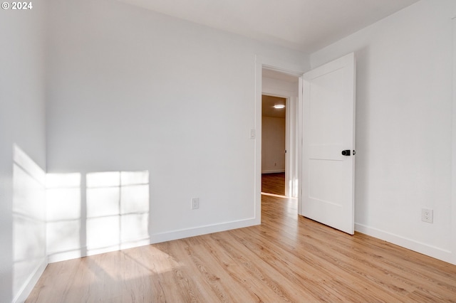 spare room featuring light wood-type flooring