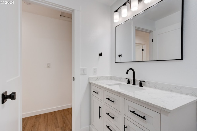 bathroom with vanity and wood-type flooring