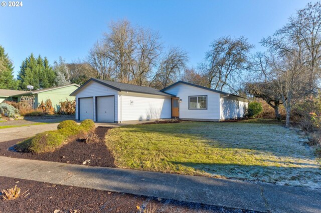 single story home with a front lawn and a garage