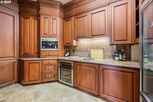 27050 SW Petes Mountain Rd, West Linn, OR 97068 - kitchen with beverage cooler, brown cabinetry, light stone counters, a sink, and tasteful backsplash