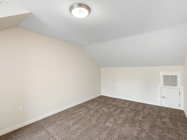 bonus room with carpet and lofted ceiling