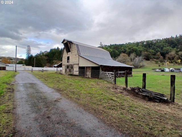 view of home's exterior featuring an outbuilding