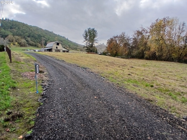 view of road with a mountain view and a rural view