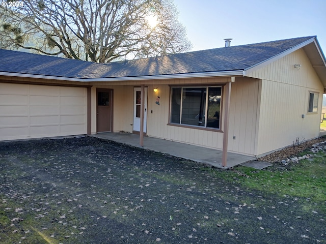 ranch-style home featuring a garage