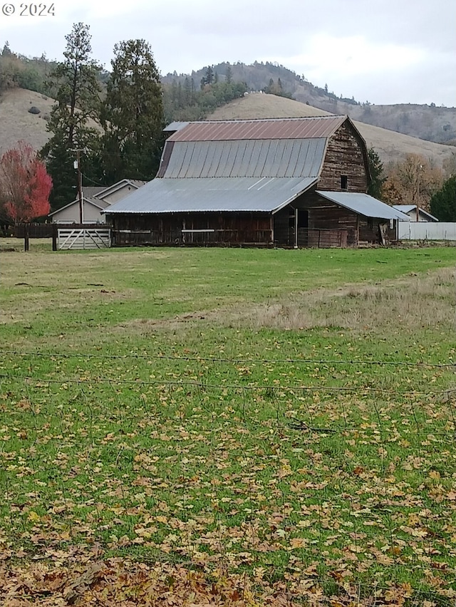 exterior space with a rural view and an outbuilding