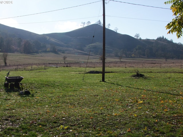 mountain view featuring a rural view