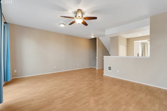 spare room featuring ceiling fan and light wood-type flooring