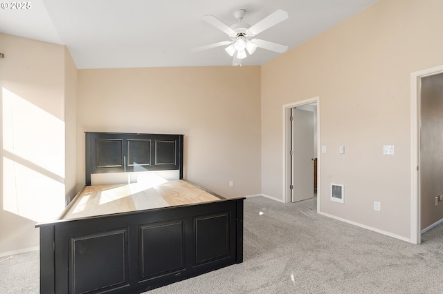 unfurnished bedroom with ceiling fan and light colored carpet