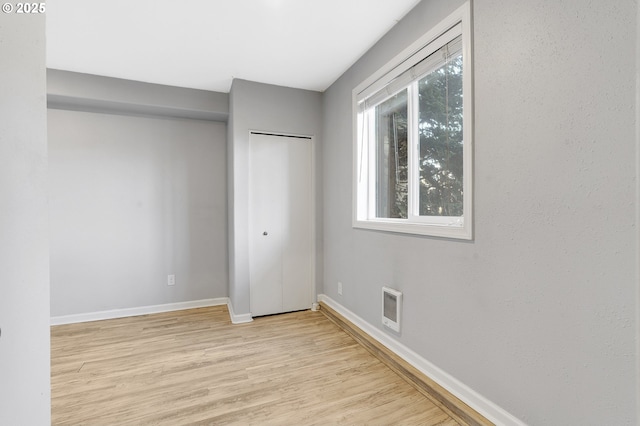 unfurnished bedroom with light hardwood / wood-style floors