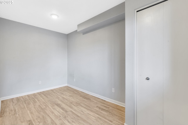 spare room with light wood-type flooring