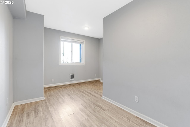 empty room with light wood-type flooring