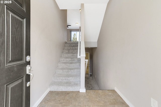 stairway with ceiling fan