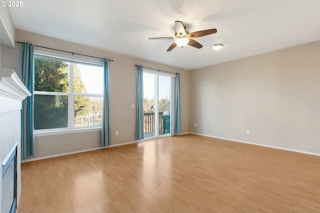 unfurnished room with light hardwood / wood-style floors and ceiling fan