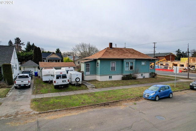 bungalow featuring a garage