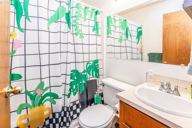 bathroom with vanity, a shower with curtain, and toilet