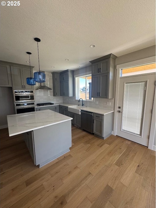 1918 S Holly St, Canby, OR 97013 - bathroom featuring vanity, decorative backsplash, and wood finished floors