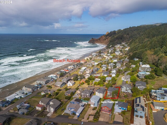 aerial view featuring a water view and a view of the beach