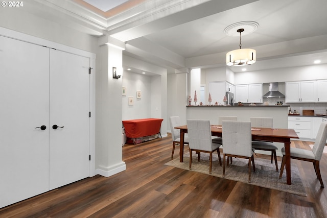 dining space with dark hardwood / wood-style floors