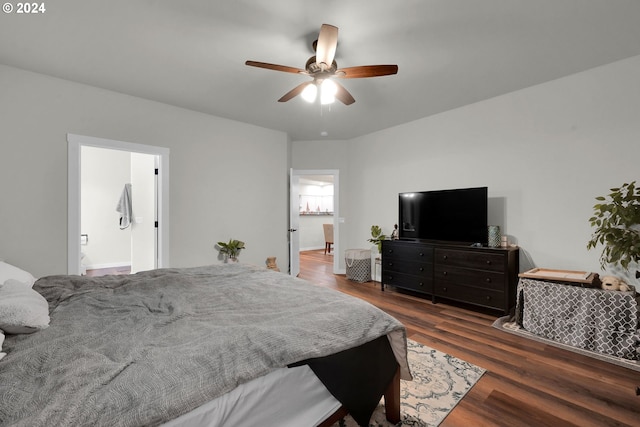 bedroom featuring ceiling fan, dark hardwood / wood-style flooring, and ensuite bath