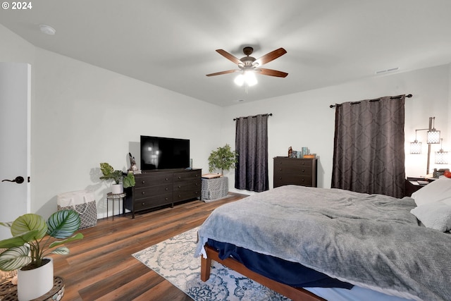 bedroom featuring ceiling fan and dark hardwood / wood-style flooring