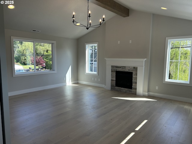 unfurnished living room with a chandelier, wood finished floors, baseboards, a fireplace, and recessed lighting
