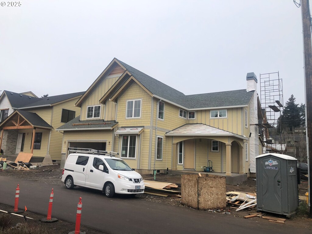 view of front facade with a front yard and a garage