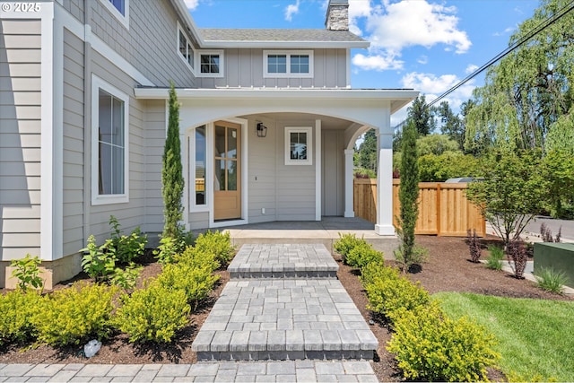 1218 9th St Lot 3, West Linn, OR 97068 - doorway to property with board and batten siding, covered porch, and a chimney