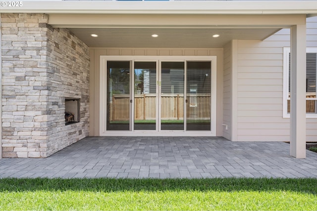 1218 9th St Lot 3, West Linn, OR 97068 - view of exterior entry with an outdoor stone fireplace and a patio
