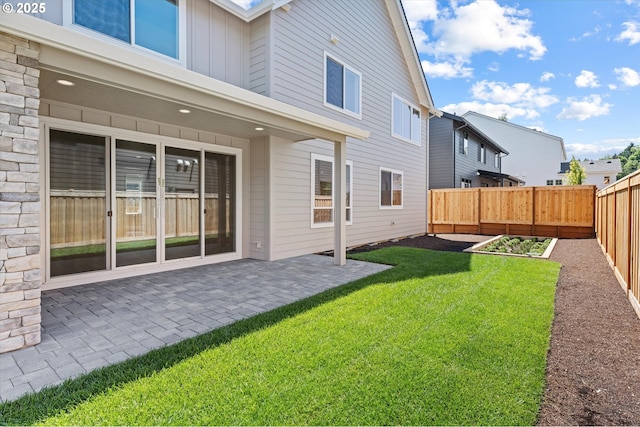1218 9th St Lot 3, West Linn, OR 97068 - back of house with a garden, a patio area, and board and batten siding