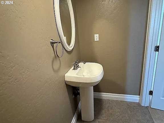 bathroom with tile patterned flooring