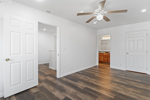 unfurnished bedroom featuring dark wood-style floors, recessed lighting, visible vents, and baseboards