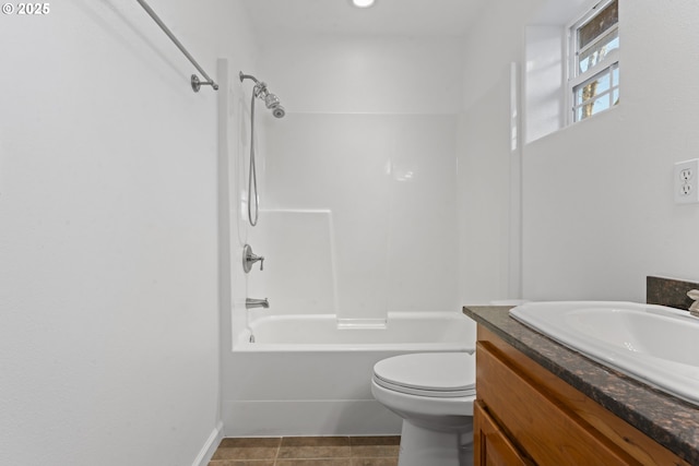 full bath featuring toilet, vanity,  shower combination, tile patterned flooring, and baseboards