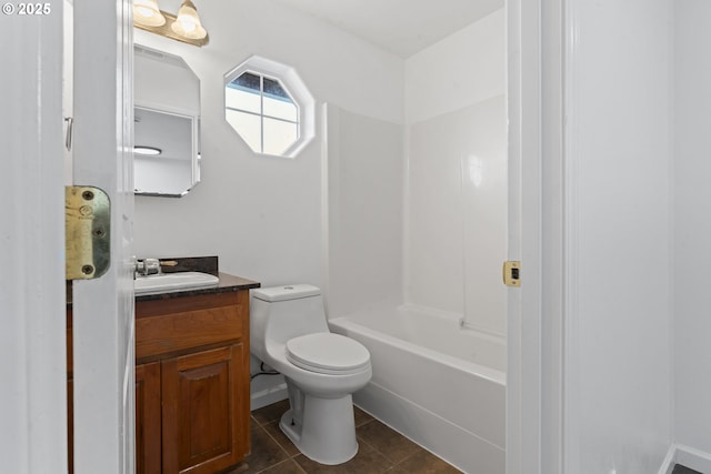 bathroom featuring vanity, toilet, and tile patterned floors