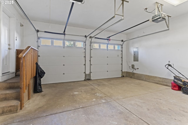 garage featuring a garage door opener and electric panel