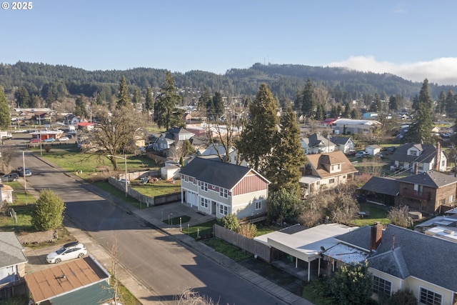 drone / aerial view featuring a view of trees