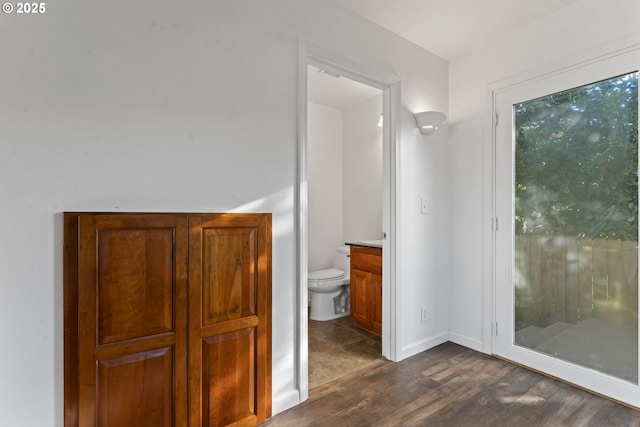 interior space featuring dark wood-style floors and baseboards