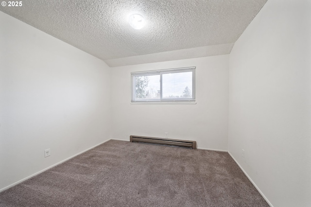 spare room featuring carpet, lofted ceiling, a textured ceiling, and a baseboard heating unit