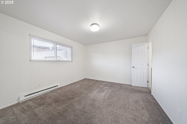 unfurnished room featuring carpet flooring and a baseboard heating unit