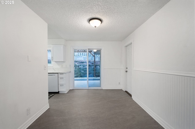 interior space with a textured ceiling