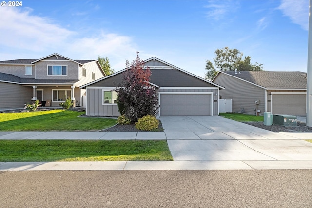 view of front of home featuring a front yard and a garage