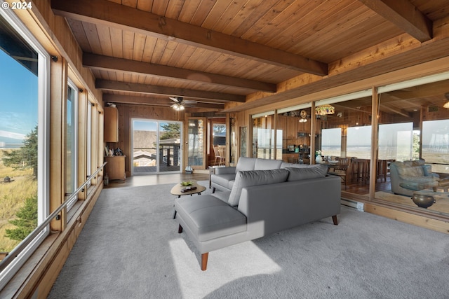 carpeted living room featuring wooden ceiling, ceiling fan, and beam ceiling