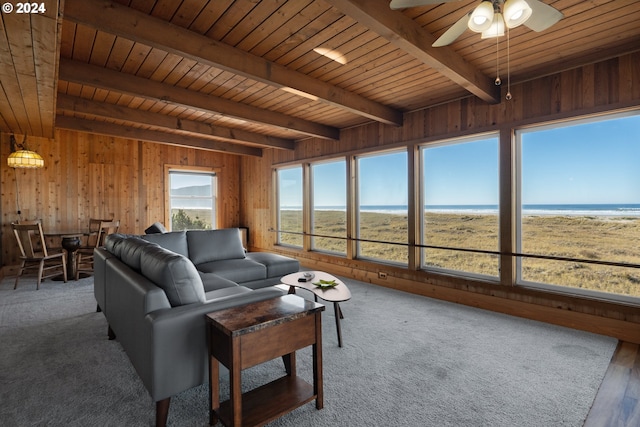 living room featuring a water view, wood ceiling, hardwood / wood-style floors, wood walls, and beamed ceiling